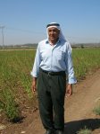 Abu Zaki next to his sesame crop